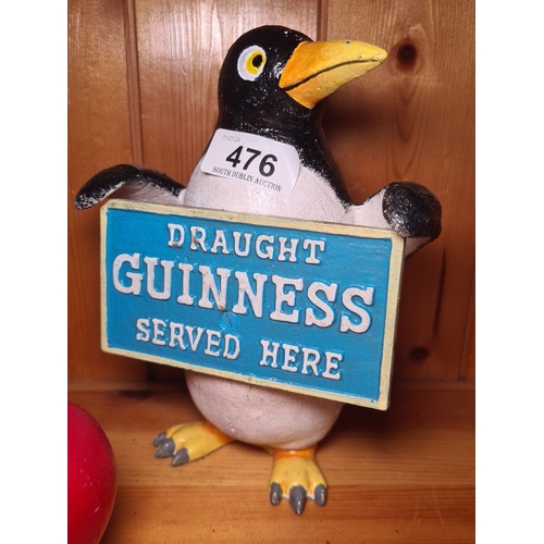 476 - A very heavy cast metal Guinness penguin advertising moneybox figure, hand-painted. Features 