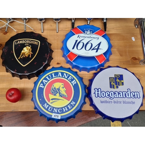 478 - Four metal bottle cap wall signs. Each measuring approximately 12 inches in diameter. Featuring desi... 