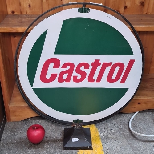 479 - A Castrol advertising double sided swivel sign with circular metal frame and stand. Featuring classi... 