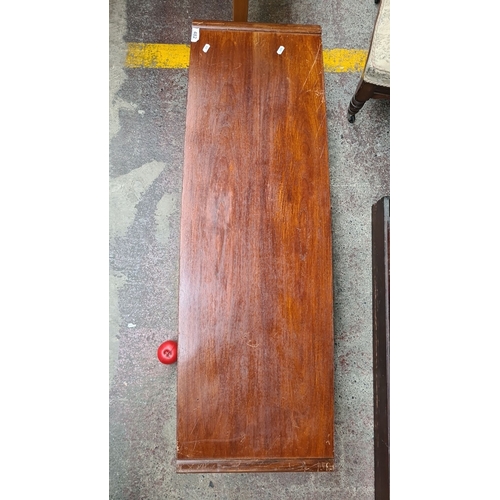 482 - A stunning Mid-Century Modern teak coffee table with under-shelf storage, circa 1960s.