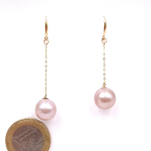 23 - Star Lot : A pair of stunning 18 carat gold drop pendant Akoya pearl earrings suitable for pierced e... 