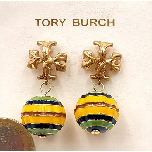 27 - A pair of drop earrings by Tory Burch. Earrings set with attractive enamelled pendant. Length - 2 cm... 