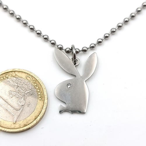 29 - A silver metal necklace with a playboy bunny pendant set with gemstone accents. Length of chain - 64... 