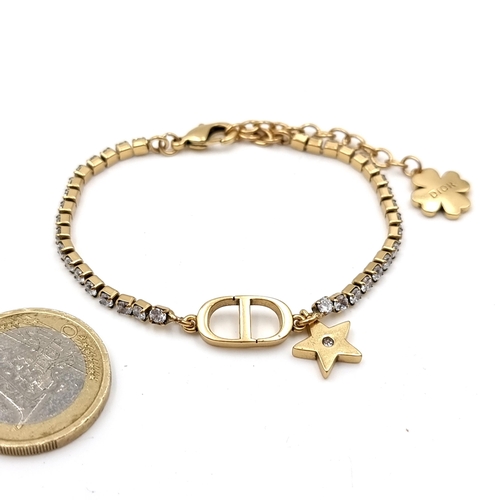 30 - Star lot : An attractive designer Christian Dior bracelet set with star accent charm. Together with ... 