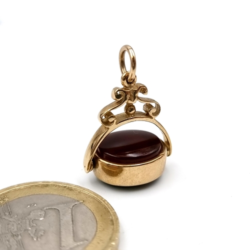 33 - A vintage nine carat gold (375) swivel gemstone pendant. Dimensions - 2.5 x 1.5 cms. Weight - 4.31 g... 