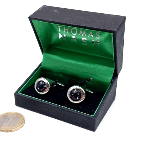 4 - A pair of Thomas Nash cuff-links set with compass dial accents. Set in presentation box.