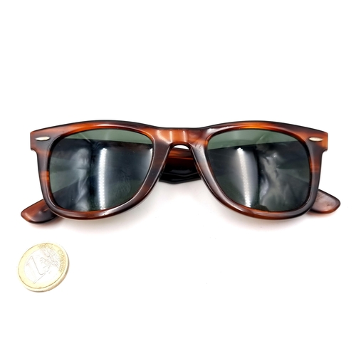 52 - A pair of Ray-Ban faux tortoise shell framed sunglasses marked USA to stem.