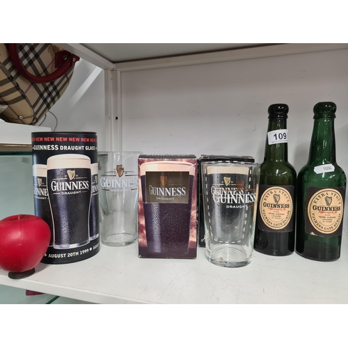 109 - A mixed lot of Guinness advertising items including a boxed 1999 draught glass, a boxed special edit... 