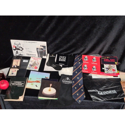 112 - A mixed lot of vintage Guinness ephemera including a limited edition beer mat, fridge magnets, birth... 