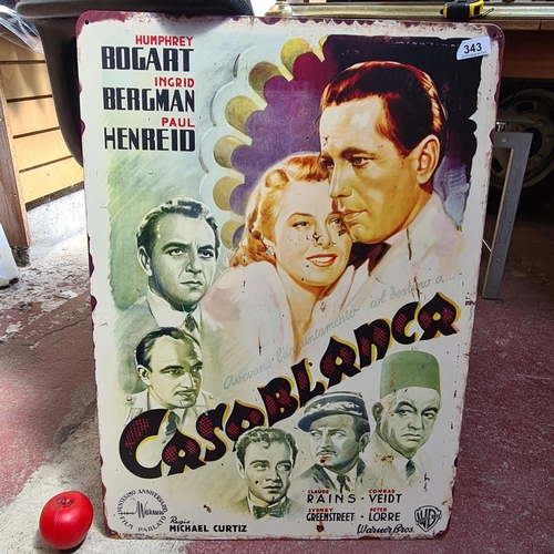 343 - A large printed metal movie poster for Casablanca starring Humphrey Bogart, Ingrid Bergman and Paul ... 