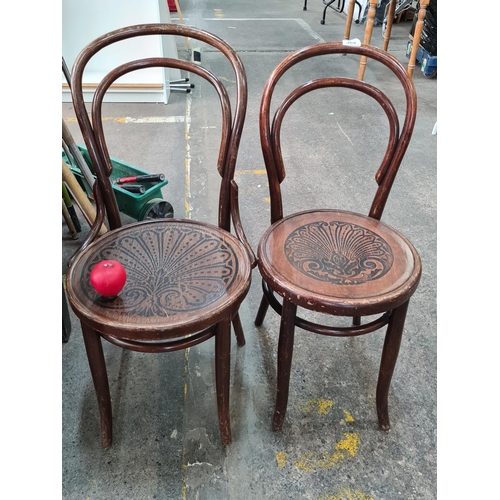 368 - A pair of early 20th century bent wood bistro chairs including a fabulous Mundus Vienna Austria exam... 