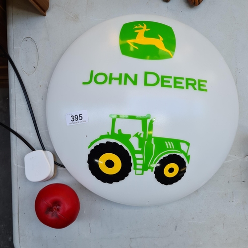 395 - A wall mounting light advertising John Deere.