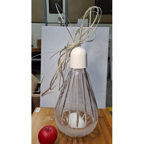 498 - A large Modern clear glass pendant light with ribbed design and white fitting. Includes wiring for h... 