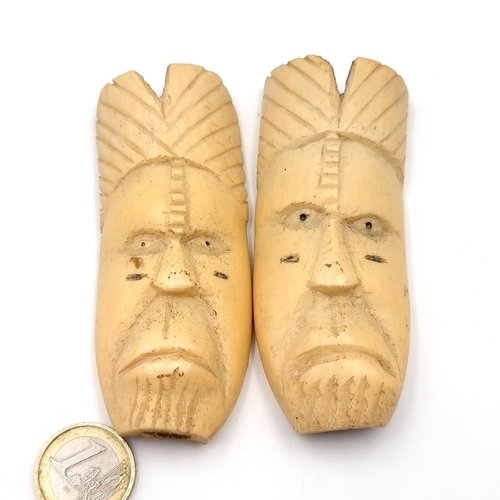 504 - An unusual pair of Japanese antique bone carved  face figures set with ring fix mounts to backs. Dim... 