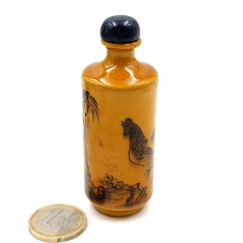 511 - A cylindrical antique Chinese perfume bottle with floral and bird scenes to body. Base signed Chengh... 