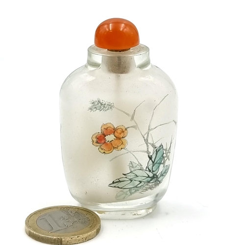 519 - A vintage glass Japanese perfume bottle with foliage and fauna. Together with original stopper. Dime... 