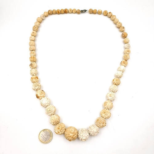 523 - An excellent example of antique bone carved graduated Tibetan necklace set with a gem set clasps. Le... 