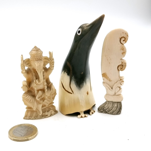 526 - A collection of three interesting antique  items consisting of a gem set eyed penguin  carved from a... 