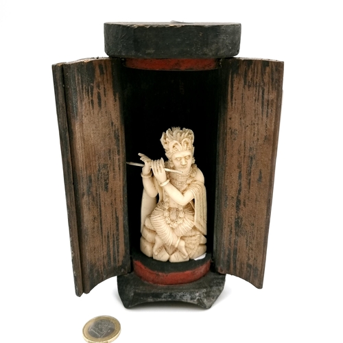 527 - Star lot : An antique Japanese bone carved figure depicting Lord Krishna playing the flute. Dimensio... 