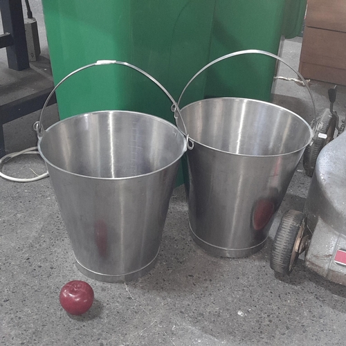 1007 - Two stainless steel handled buckets. 33cm tall.