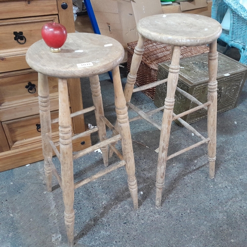 1016 - Two lovely vintage pine wood bar stools with turned wood tapered legs. 77cm tall. One foot rest piec... 