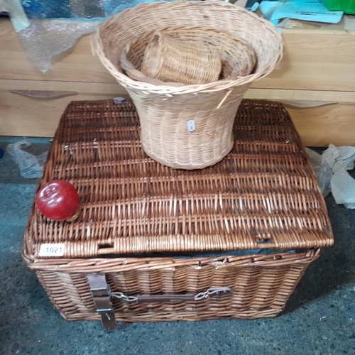 1021 - A large wicker hamper basket. MM: 57cm L X 30cm H X 45cm D