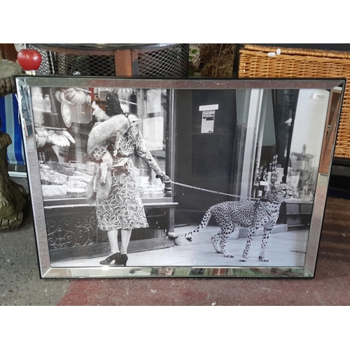 1022 - A very large fashion print of a stylish lady looking into a green grocers window with her pet cheeta... 