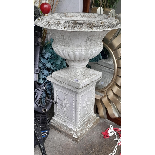 1032 - Star Lot: A large vintage pedestal garden urn painted white with a patina. MM: 95cm tall 67cm wide