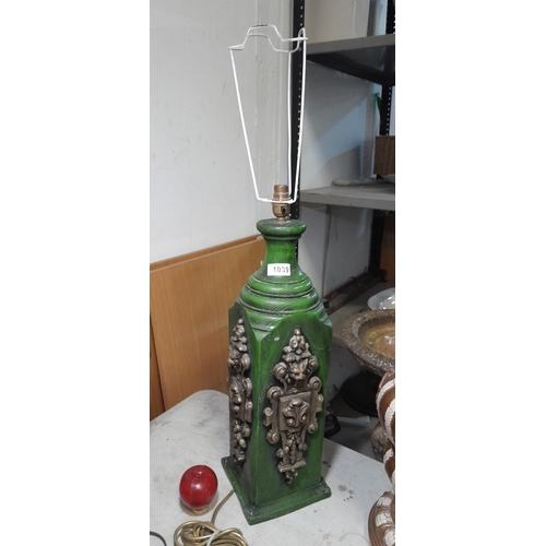 1039 - A very large green wooden table lamp with lion mask decoration and  bayonetted bulb fixture.