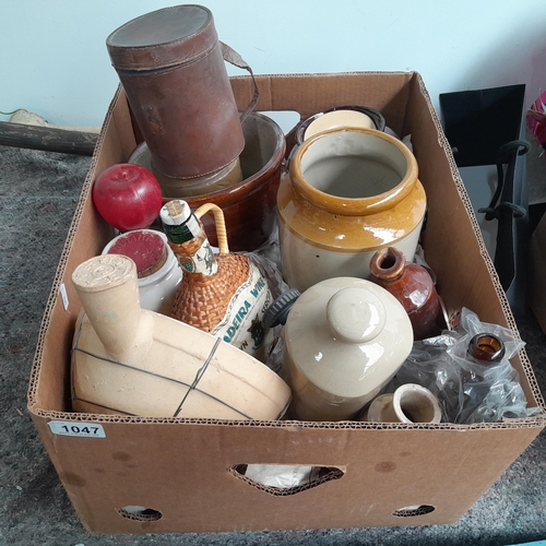 1047 - A good mixed box including 10 stoneware items, antique Guinness bottle, and a leather cylindrical ca... 