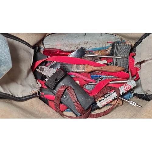 743 - Vintage leather tool bag containing assorted tools such as an axe, hand drill, pruner, screwdriver, ... 