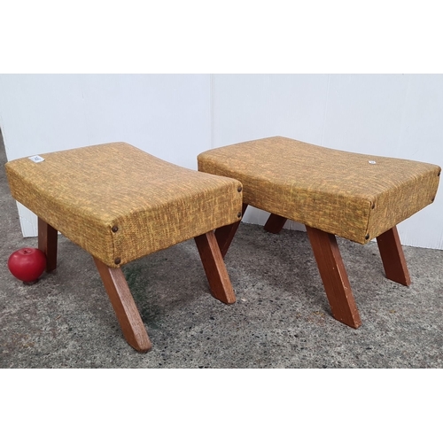 746 - Pair of Mid-Century Modern Footstools with angled wooden legs and mustard-toned fabric upholstery.