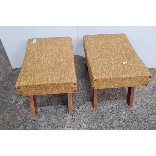 746 - Pair of Mid-Century Modern Footstools with angled wooden legs and mustard-toned fabric upholstery.