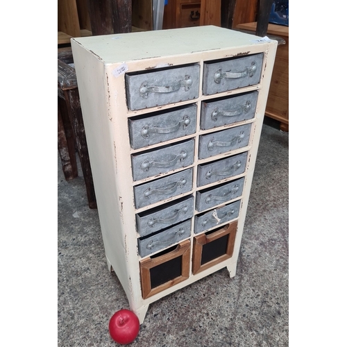 747 - Vintage-style multi-drawer cabinet featuring twelve metal drawers and two wooden drawers. Cream fini... 