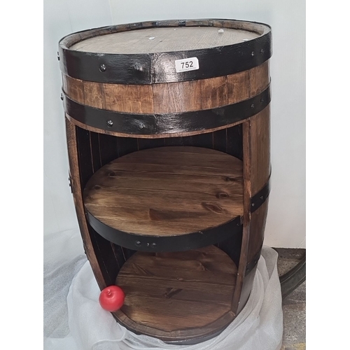 752 - Star Lot : A large Wooden barrel repurposed into a storage unit with two shelves. Accentuated with b... 