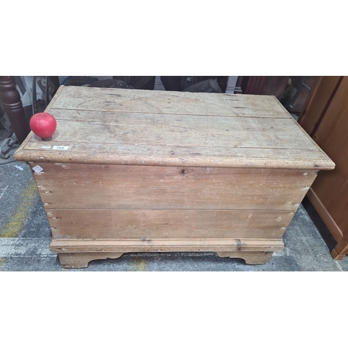 768 - Antique wooden storage chest with hinged lid. Crafted from solid wood with rustic iron hardware.