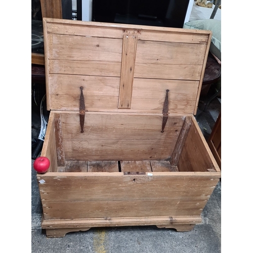 768 - Antique wooden storage chest with hinged lid. Crafted from solid wood with rustic iron hardware.