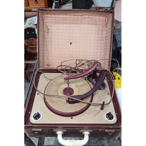 789 - Vintage portable record player housed in a brown case. Interior comprises a turntable and controls. ... 