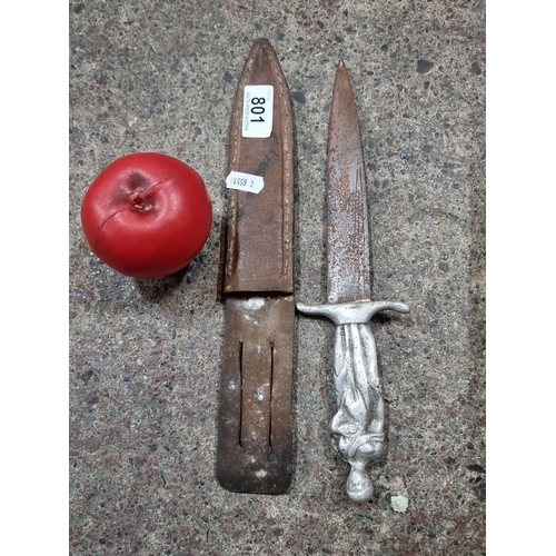 801 - Vintage Dagger with Leather Sheath. It features a sculpted metal handle depicting a standing figure.... 