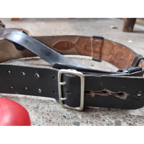 803 - Vintage black leather Sam brown rifle sling featuring adjustable buckle and cartridge loops. The sli... 