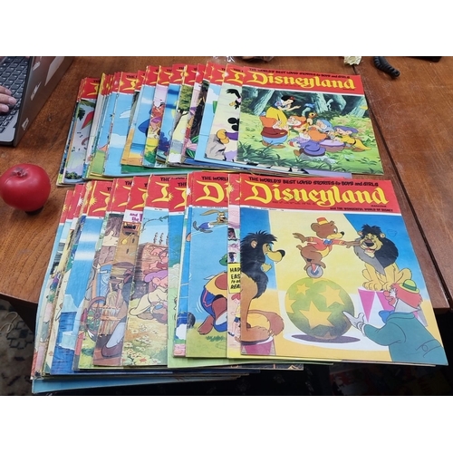 820 - A vibrant collection of Disneyland magazines, showcasing beloved Disney characters and stories. Issu... 