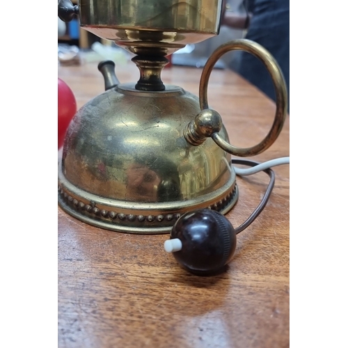 858 - Antique brass oil lamp with frosted glass chimney and electric conversion. Features ornate detailing... 