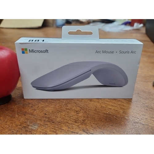 881 - Microsoft Arc Mouse, new in box. Features Bluetooth connectivity, and touch-scroll capabilities. Inc... 