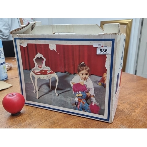 A classic Children's vanity set featuring a mirror and table in white with intricate details and curved legs. The Following Lots are from a fabulous ingle family vintage toy collection, Its an amazing collection overall and in super condition.