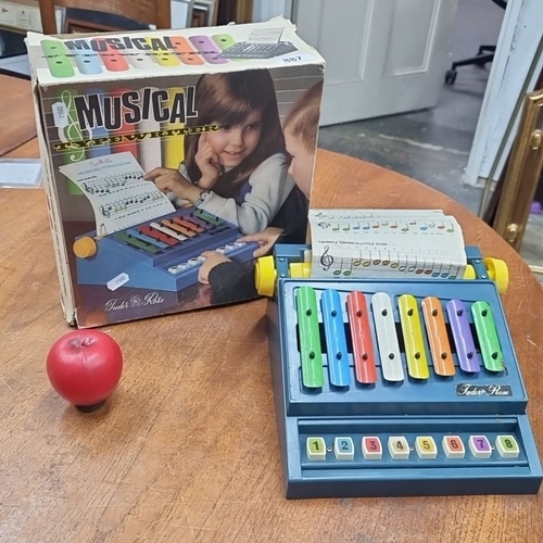 887 - A vintage Tudor Rose Musical Typewriter toy with original box. It includes colorful xylophone-style ... 