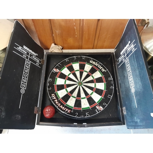 1037 - A Guinness branded dart board with a unicorn dynamite bristle dart board.