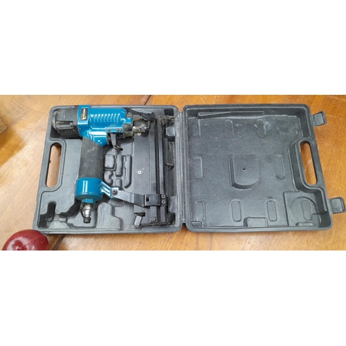 919 - A high quality Workzone air nail gun in its original hard shell travel case.