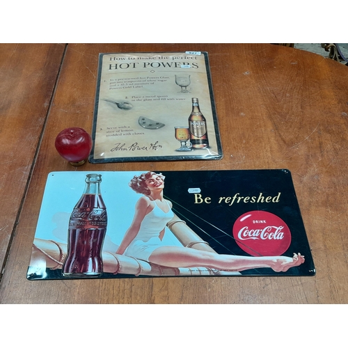 927 - Two good sized metal advertising signs including one for Powers and one for Coca Cola.