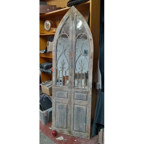 929 - Star lot : An excellent large garden mirror in the form an ecclesiastical gothic door. RRP 199.