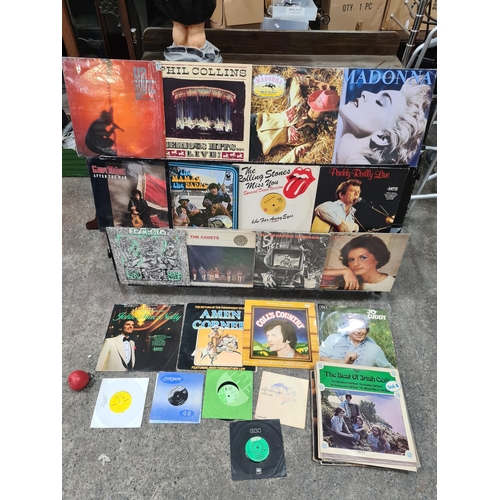 954 - A box comprising of vinyl records from artists and bands such as U2, Phil Collins, Madonna, The Mama... 